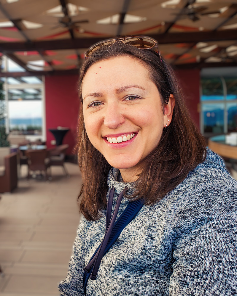 image of Rachel Cardy sitting in an outdoor patio
